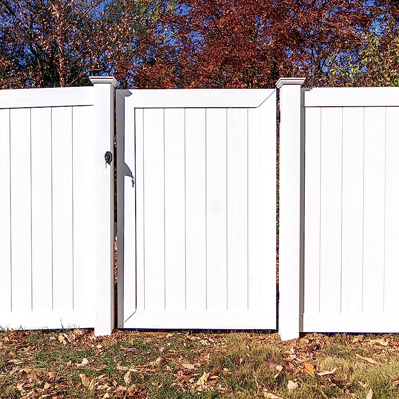 Swinging Gate Feature White vinyl swinging gate
