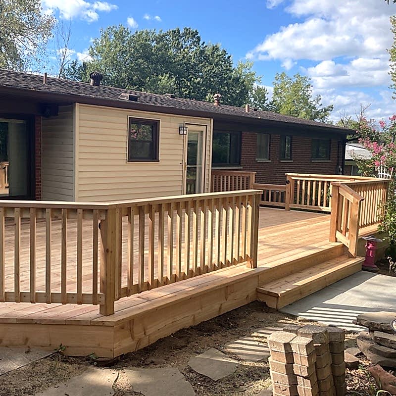 Treated Wood – Feature 1-2 Large wood deck with steps and railing